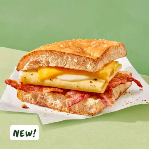 Panera Bread Bacon Double Take Boxed Breakfast featuring crispy bacon, scrambled eggs, and fresh bread, served with a side of fresh fruit, perfect for a wholesome morning meal